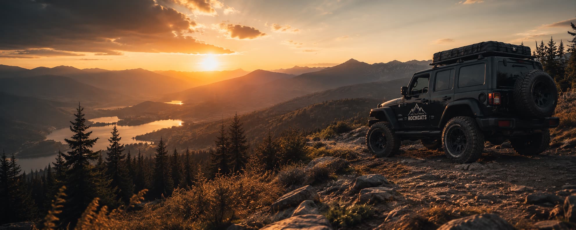Jeep climbing summit at golden hour